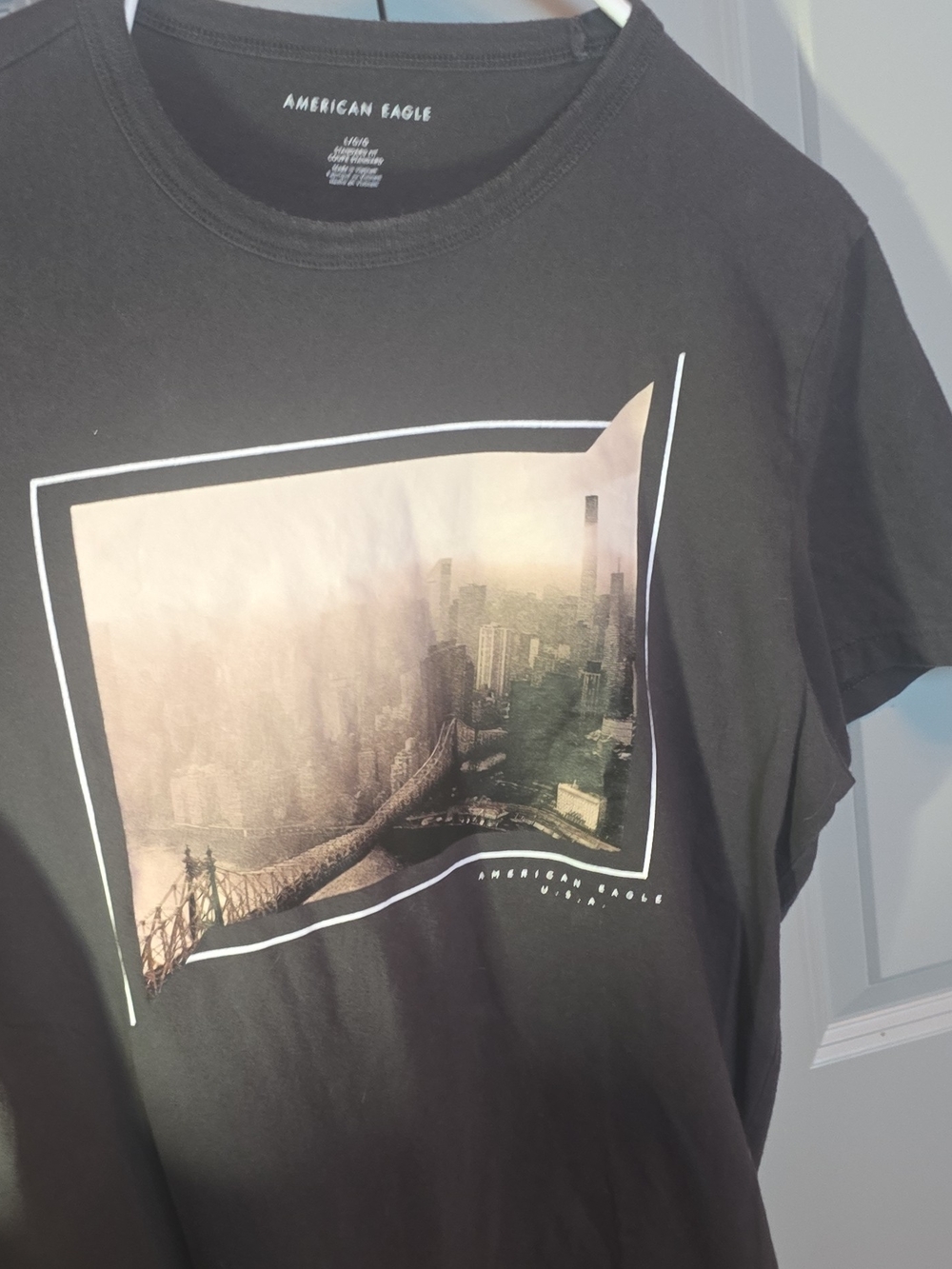 American Eagle Outfitters Black T-Shirt with Sepia Cityscape Graphic